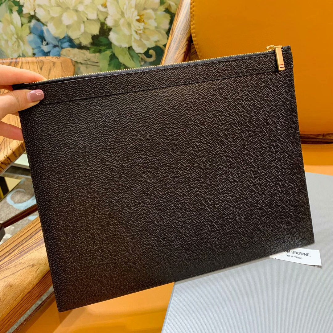 Three-color woven clutch bag